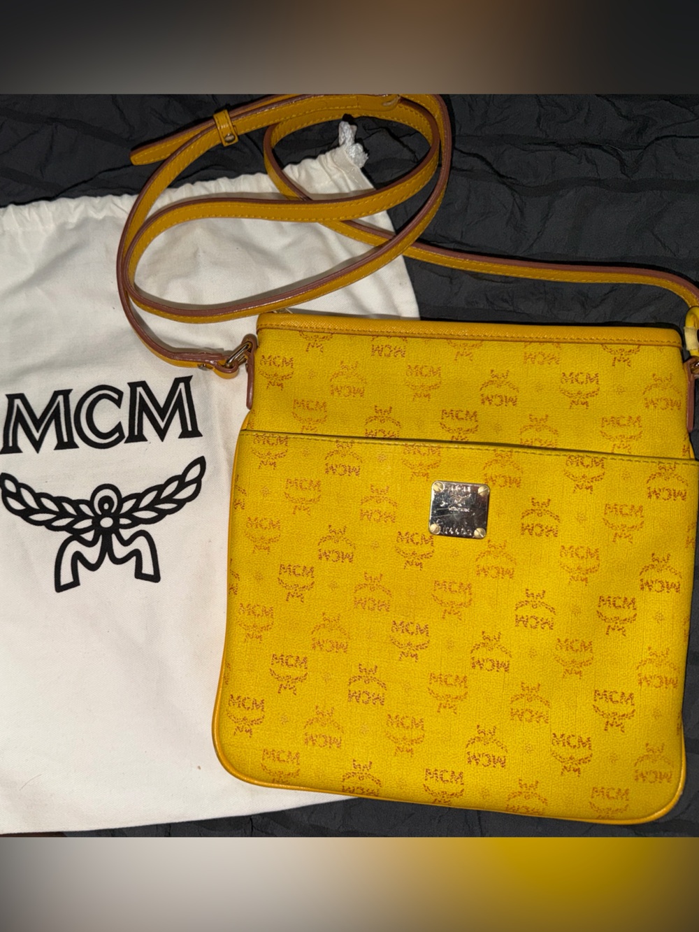 MCM Visetos yellow crossbody bag with a crybaby plush doll